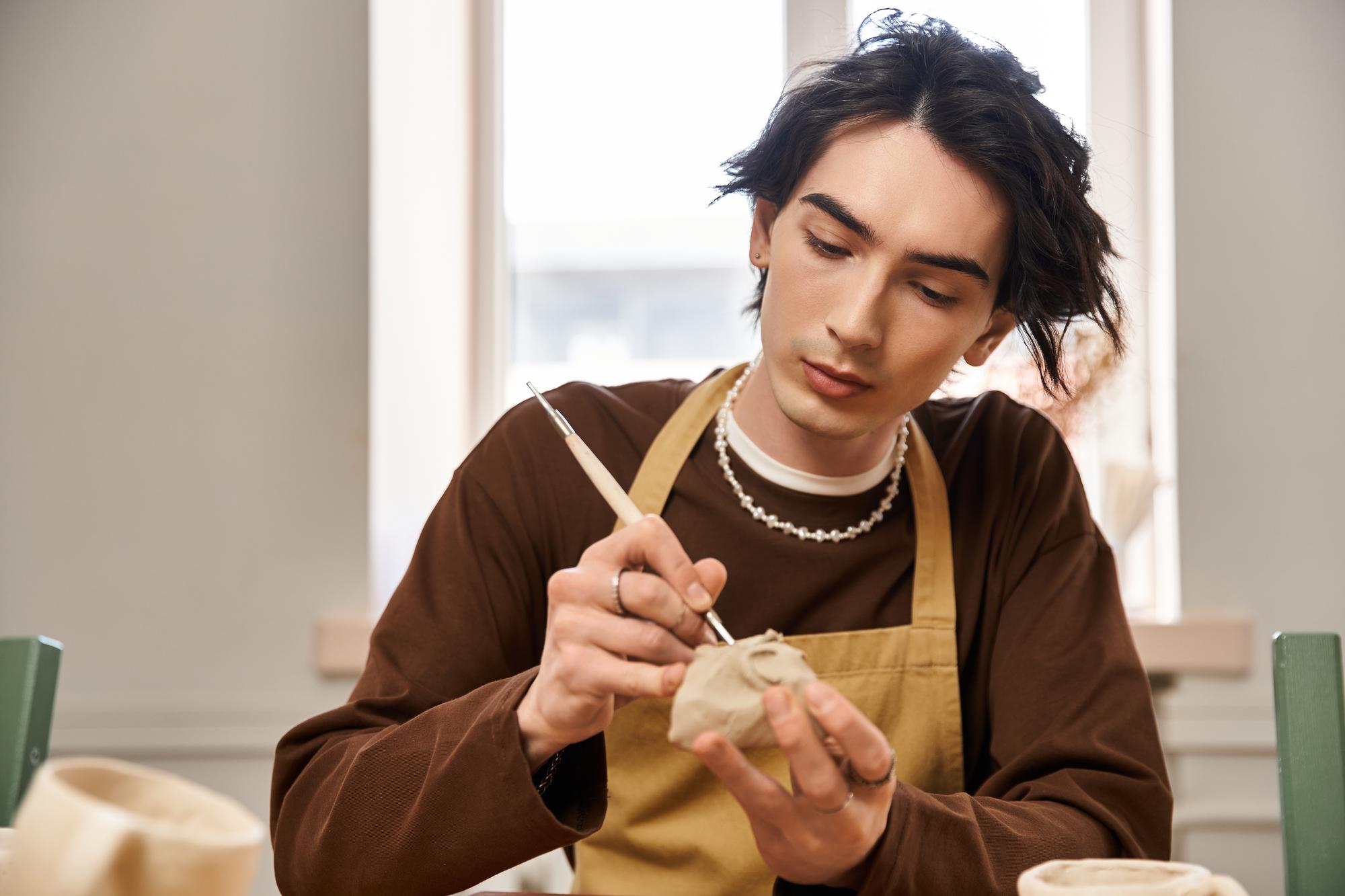 artisan at work with needle and hoop